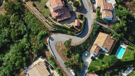 Tanneron-France-Aerial-v13-establishing-shot,-vertical-straight-down-view-capturing-winding-hill-path-and-local-residential-houses-in-les-mauberts---July-2021