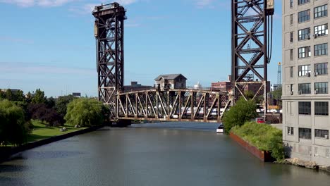 historic-vertical-lift-bridge-as-a-train-passes-over-river-4k