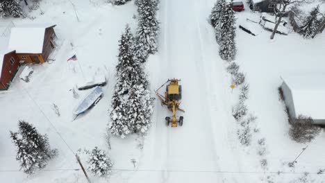 Drone-video-captures-the-power-and-a-snow-plow-in-action-as-it-clears-snow-in-the-winter-wonderland-of-Alaska