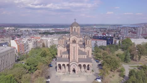 Incredible-establishing-aerial-shot-of-St-Mark-Church-in-Tasmajdan-park-in-Belgrade