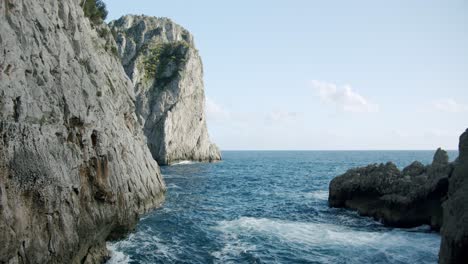 Side-view-of-the-Faraglioni-in-Capri,-in-Italy,-during-a-sunny-day-in-spring