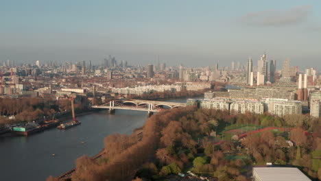 Aerial-slider-shot-of-London-skyline-from-Battersea-park
