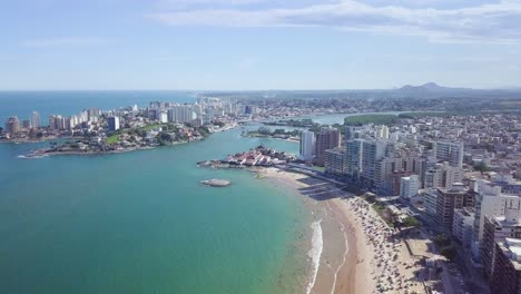 Static-drone-footage-of-the-Praia-do-Morro-in-Guarapari,-Brazil,-a-sunny-tropical-city