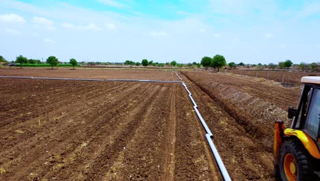 agricultural-landscape-aerial-view-of-arable-crop-field,-fittings-of-Pipeline-transportation-of-water