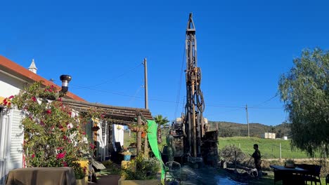 The-auger-of-a-drilling-rig-slowly-goes-deeper-into-the-hard-ground-in-search-of-water
