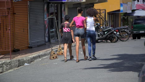 Three-young-women-walking-in-the-street