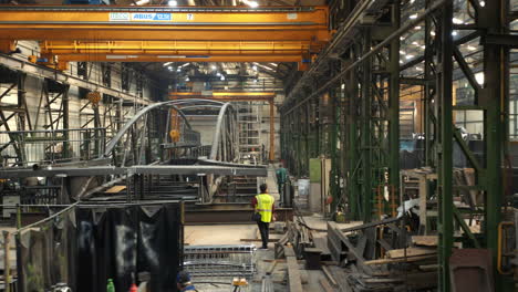 Manufacturing-of-steel-bridge-in-industrial-welding-factory-hall