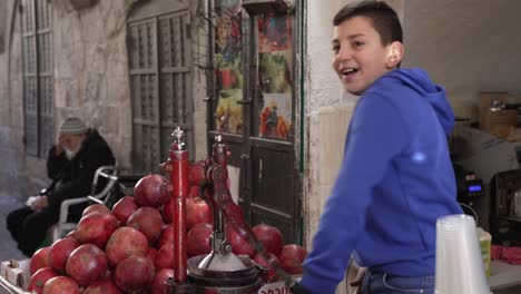 Fresh-orange-and-pomegranate-juice-prepared-on-an-old-metal-juice-press-squeeze-machine-street-seller