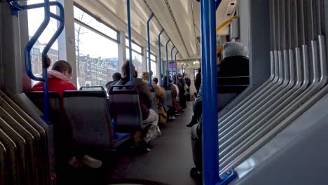 Seated-behind-the-center-of-an-Amsterdam-tram-leaving-Central-Station