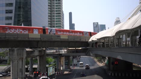 BTS-Sky-Train,-approaching-Chong-Nonsi-station-in-Sathorn,-Bangkok,-Thailand
