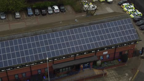 Widnes-town-police-station-with-solar-panel-renewable-energy-rooftop-in-Cheshire-townscape-aerial-view-top-down