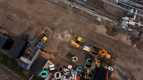 ALDI-supermarket-construction-building-site-aerial-view-looking-down-over-industrial-framework-development,-UK