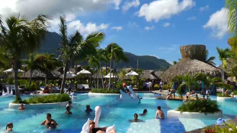 Tourists-relaxing-at-the-pool-in-Taino-Bay,-Puerto-Plata,-Dominican-Republic