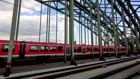 17-April-2023---Regional-Express-Train-From-Deutsche-Bahn-Crossing-Hohenzollern-Bridge-In-Cologne