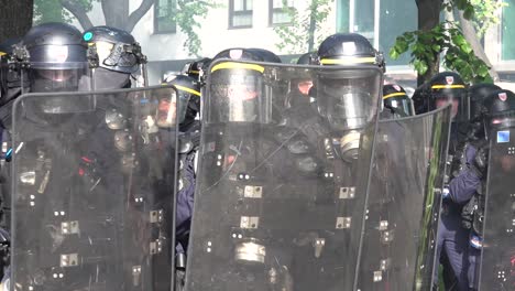 Riot-police-get-ready-to-clear-the-crowd-of-protesters-during-the-May-Day-protest-in-Paris,-France
