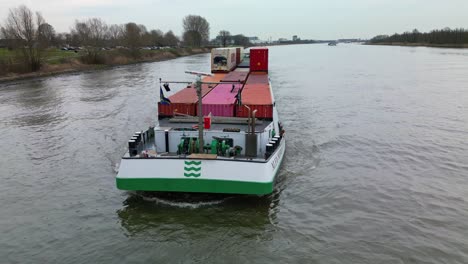 Cargo-ship-loaded-with-containers-sailing-in-river