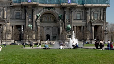 People-Enjoying-Sun-At-Lustgarten-With-Springbrunnen-Fountain-And-Berlin-Cathedral-In-Background
