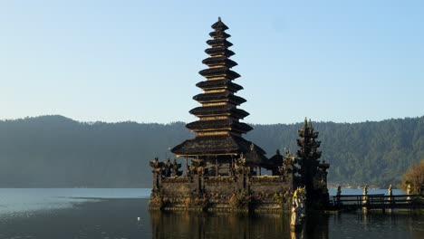 The-majestic-hindu-temple-Pura-Segara-Ulun-Danu-Batur-at-the-volcanic-lake-on-bali-in-indonesia-with-view-of-the-lake-and-nature-during-a-summer-trip-through-indonesia