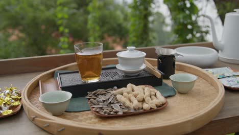 A-set-for-Chinese-tea-ceremony-on-a-wooden-table-on-outdoor-terrace