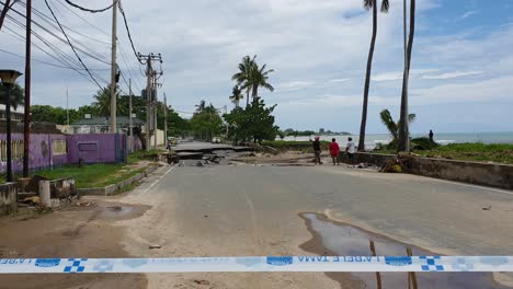 Main-road-on-the-waterfront-of-capital-Dili,-Timor-Leste-washed-away-and-damaged-from-torrential-rain-and-flooding-throughout-the-country-during-wet-season