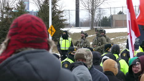 Freedom-convoy-in-Canada-with-groups-of-armed-officers-and-policemen
