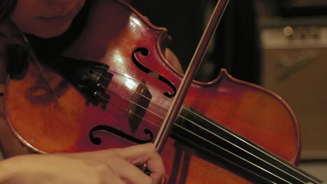 Close-Up-of-Musician-Playing-Violin-in-Studio