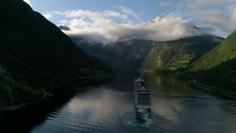 Rear-Orbit-Shot-of-the-MSC-Preziosa-Cruise-Ship-Sailing-Through-the-Geirangerfjord-in-Norway