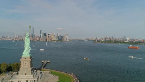 Aerial-Pullback-of-the-Statue-of-Liberty-with-the-Manhattan-Skyline-and-One-World-Trade-Center