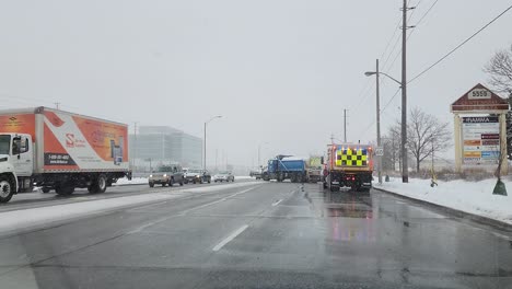 Snow-plow-services-clearing-snow-for-freeway-traffic-in-Toronto