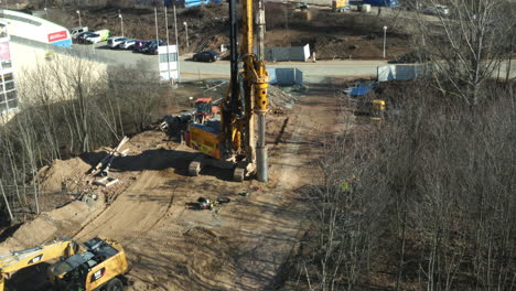 Drilling-machine-excavator-digging-in-ground-at-construction-site