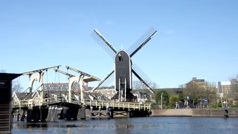 Windmill-De-Put-Beside-Rembrandt-Bridge-In-Lieden-On-Sunny-Day-With-Clear-Blue-Skies