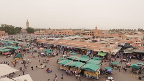 Panning-view-of-Jemaa-el-Fna-in-Marrakesh,-Morocco-from-above