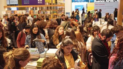 Pan-across-bustling-bookfair-full-of-people-eager-to-learn-and-read