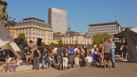 Crowd-Of-People-Gather-In-The-Poelaert-Square-During-The-Piknik-Elektronik-Event-In-Brussels,-Belgium