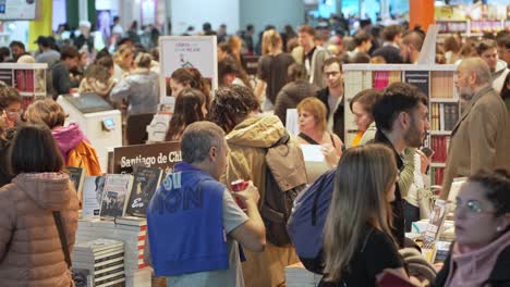 Bustling-crowd-of-people-walk-through-argentina-bookfair-exploring-novels-and-literature