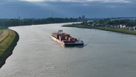 Arctic-Cargo-Container-Ship-Paired-With-Barge-Travelling-Along-River-Noord