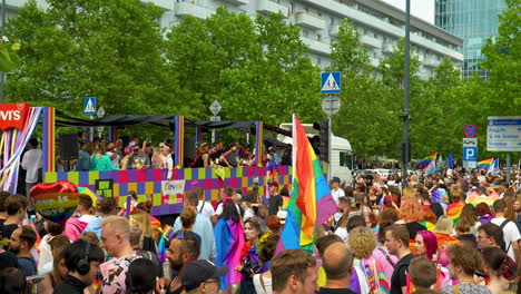 Slow-motion-shot-of-happy-people-celebrating-equality-with-rainbow-flags-on-street-of-Warsaw