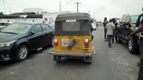 Tricycle--riding-in-the-streets-of-Lagos,-Nigeria
