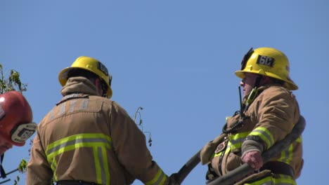 firefighters-work-on-rooftop-