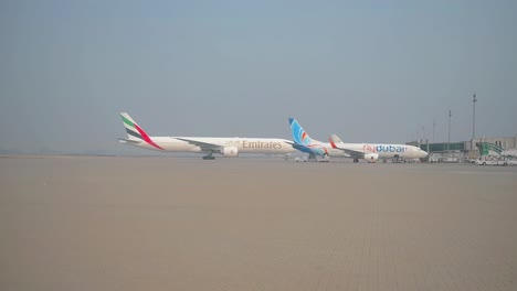 Emirate-airline-plane-parking-along-with-Fly-Dubai-Plane
