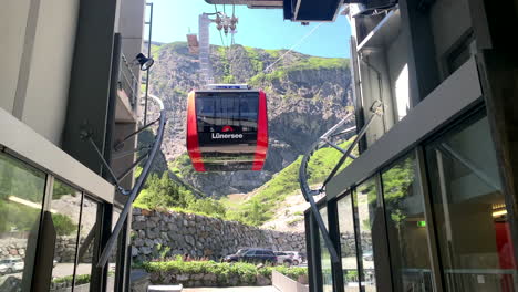 A-cable-car-approaches-the-mountain-with-people-on-board