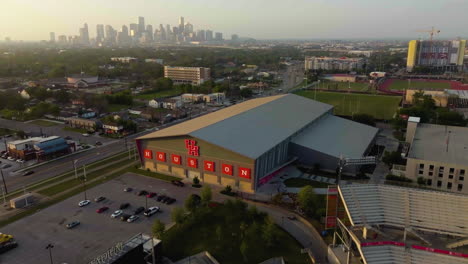 Aerial-view-around-the-Football-indoor-practice-facility,-at-the-University-of-Houston,-golden-hour-in-Texas,-USA