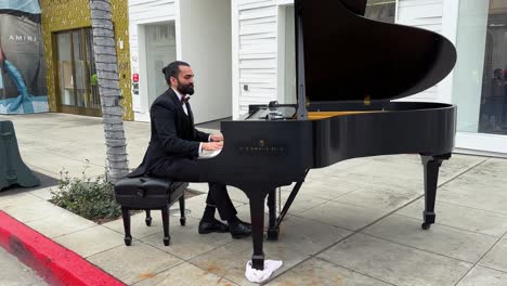 Male-Musician-Playing-Piano-On-Rodeo-Drive-Street-Pavement-In-Beverly-Hills