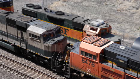 BNSF-train-passes-static-locomotives-on-railway,-Denver-Colorado