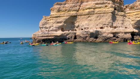 4-K-of-Kayaks-at-the-Bengali-Beach-Caves-on-the-Algarve-coast-Portugal-near-the-Elephant-Rock-Cliffs