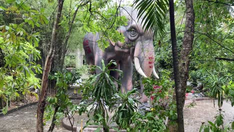 Tranquillity-surrounding-and-an-Elephant-sculpture-for-praying-and-worshipping-in-Wat-Samphran-Temple-in-Nakhon-Pathom-province,-West-of-Bangkok,-Thailand