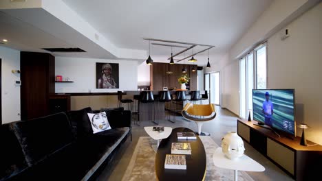 Walking-Through-a-Luxurious-Contemporary-Living-Room-towards-a-Modern-Kitchen
