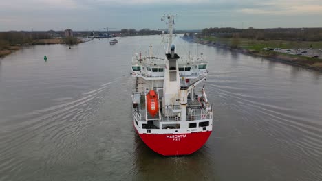 Aerial-view-of-empty-container-vessel-Marjatta-navigating-through-the-inland-canal