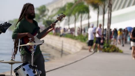 Man-plays-the-guitar-at-Praca-Maua-in-the-center-of-Rio-de-Janeiro,-Brazil