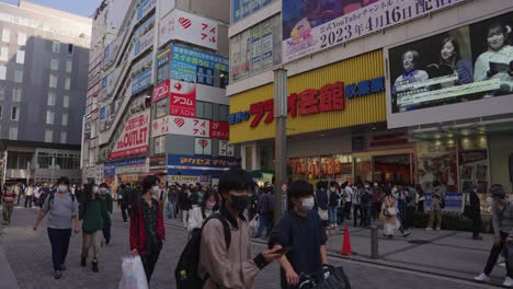 Anime-Stores-at-Akihabara-Electric-Town,-Tilt-Reveal-Shot